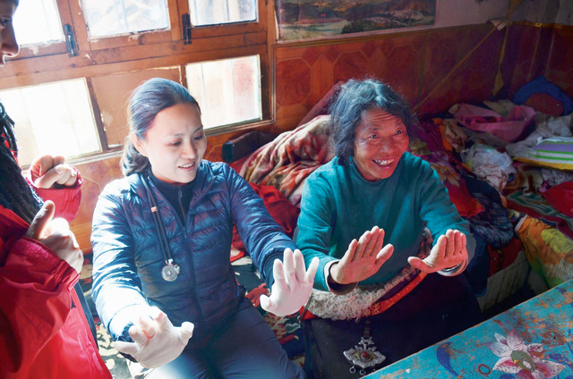 Conducting a basic examination of a Tibetan woman
