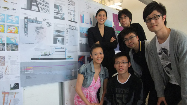 Prof. Marisa Yiu, assistant professor at the School of Architecture and master students pose in front of their project 'New Market and Waterfront Communities' in Aberdeen.