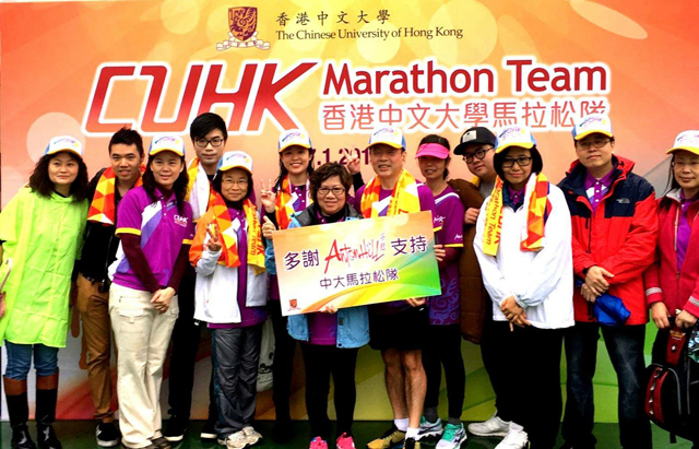 Mr. and Mrs. Sin (5th and 6th from right) at the Standard Chartered Hong Kong Marathon