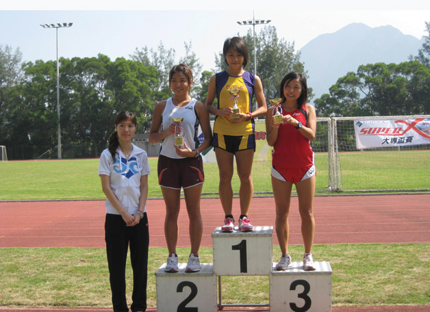 Nurses are trained to be brisk walkers, but few come close to her in terms of being light-footed. Miss Yu Kit-ching (2nd right), a Year 3 Nursing Student, won the woman's individual championship for the second year running in the Annual Cross Country Meet of the University Sports Federation of Hong Kong.