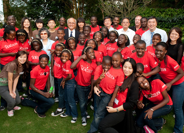 The Watoto Children's Choir, made up of children orphaned by AIDS or warfare in Uganda, was in Hong Kong to take part in S.H. Ho College's celebration of its fourth anniversary in October 2010. Here the children were seen having a good time in the garden of the Vice-Chancellor.