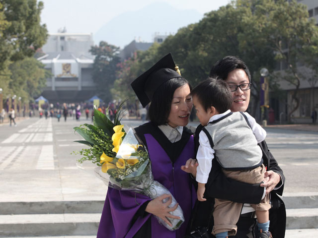 The 70th Congregation for the Conferment of Degrees<br><br>Little gentleman sweetly greets PhD graduate of 2011.